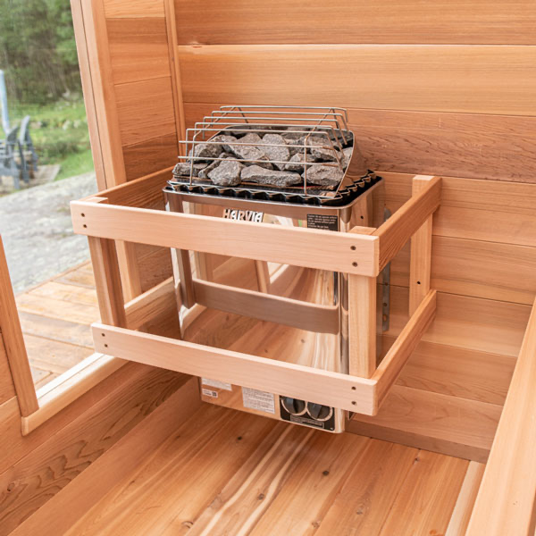 Slightly front-side view of a sauna heater with rocks, showcasing its sleek design and integrated stone feature.