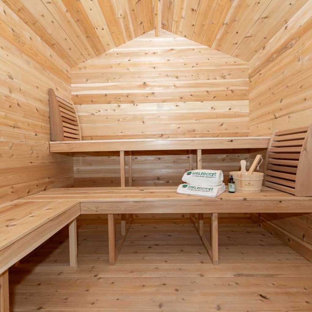 Interior view of a Georgian cabin sauna featuring benches and a warm, inviting atmosphere.