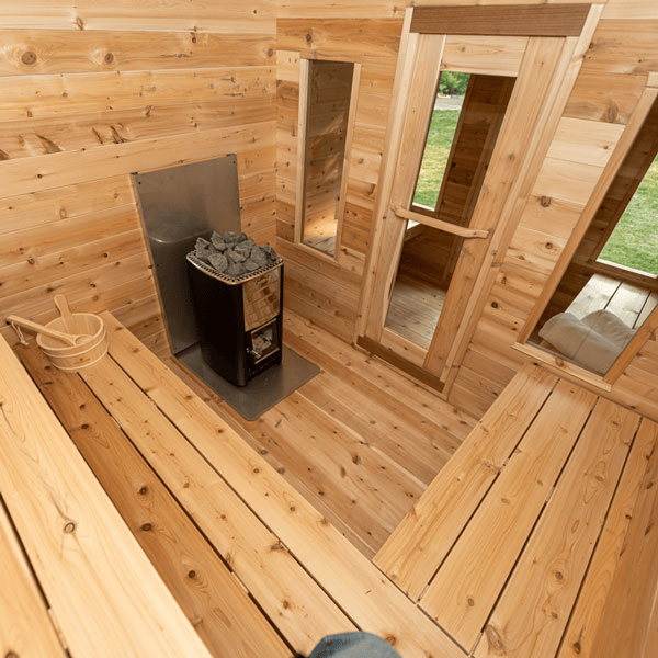 Main room view of the Georgian Cabin Sauna with Changing Room showcasing the heater