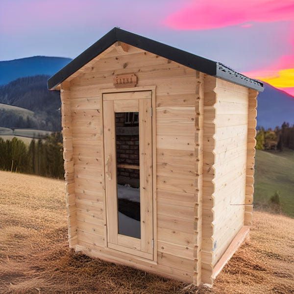 Front view of the Granby Cabin Sauna featuring a glass door, set against a mountainous background.