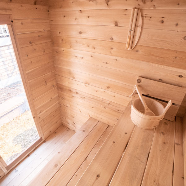 Inside front view of the Granby Cabin Sauna, featuring two benches.