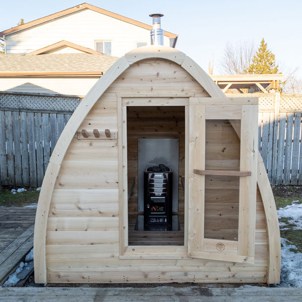 Front view of a Mini POD Sauna with the door open, featuring the sauna heater inside.