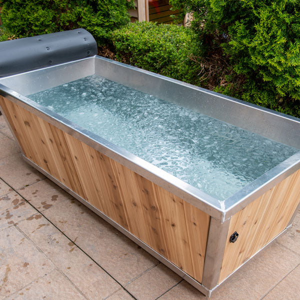 Open view of the Polar Plunge Tub featuring ice cubes floating in the water, highlighting its cold plunge functionality.