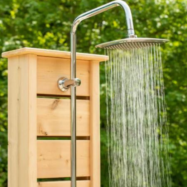 Close-up view of the Canadian Timber Sierra Pillar Shower with water pouring, highlighting its rustic design and functionality.