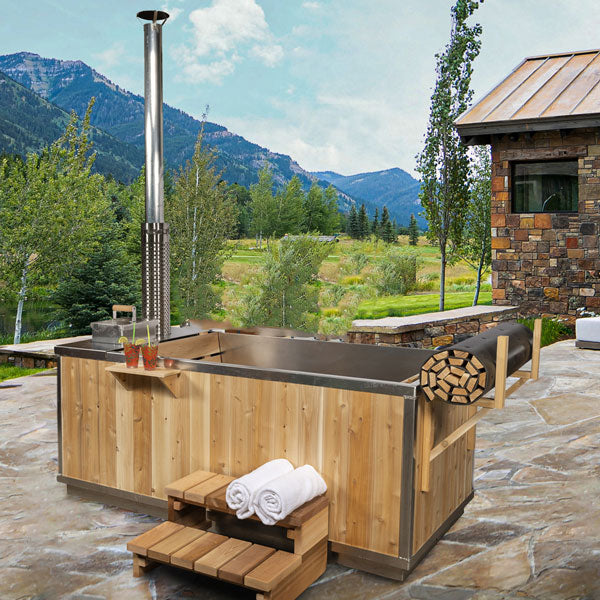 Side view of the Starlight Hot Tub made of cedar, showcasing the flue pipe prominently.