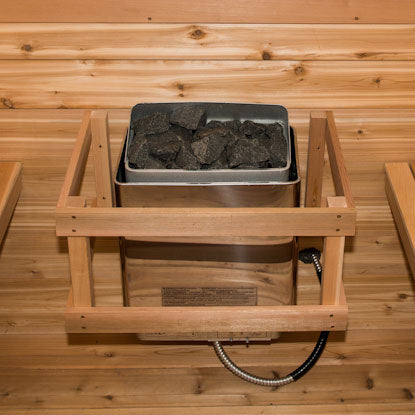 Saaku Electric Heater - 6KW with rocks on top, showcasing a modern design suitable for sauna use.