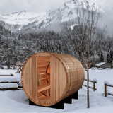 A lifestyle image of the Golden Designs Zurich 4-Person Traditional Barrel Sauna