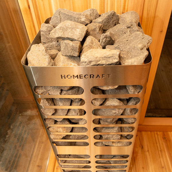 Front and top angled view of the Homecraft Revive 6kW electric sauna heater featuring sauna rocks.