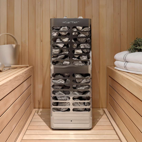 Front centered angled view of the Homecraft Revive 7.5kW electric sauna heater showcasing sauna rocks.