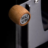 Close-up view of the door handle on the Huum Hive wood burning sauna heater model HIVEWOOD, highlighting its sleek design.