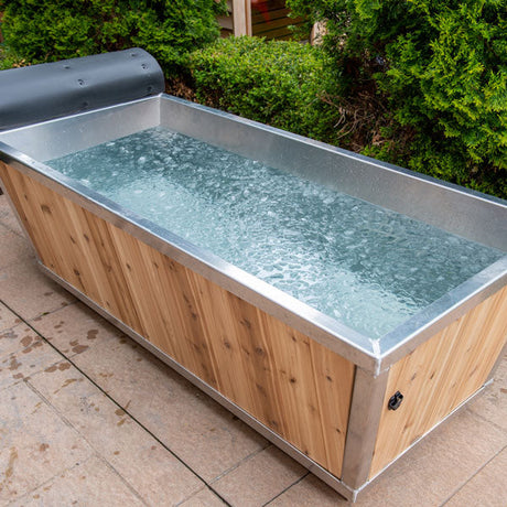 Open view of the Polar Plunge Tub featuring ice cubes floating in the water, highlighting its cold plunge functionality.