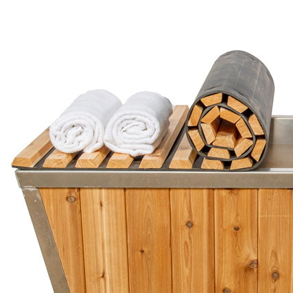 A piece of knotty cedar wood slightly rolled up, revealing its rich grain and texture. The wood showcases warm tones and natural variations, emphasizing its rustic character.