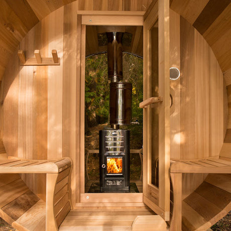 An exterior view of the Top Chimney and Heat Shield Set equipped with a water tank, specifically designed for full back wall saunas. The image captures the entire assembly installed on a sauna, emphasizing its design and functionality in a natural outdoor setting.