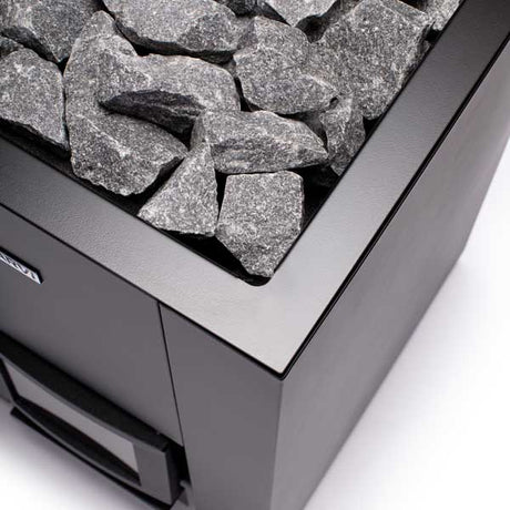 Angled view of the NARKAAM Kamos 20 with a semi-edged stone design and a black finish.