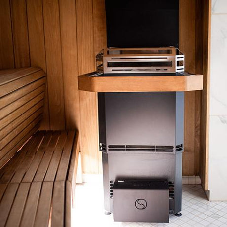 A view of the Saunum Air L Sauna Heater installed in a sauna room
